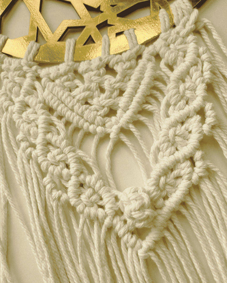 Close-up of handcrafted Islamic macramé wall hanging featuring detailed cotton knots and a gold crescent ayah plate – Samra Knots