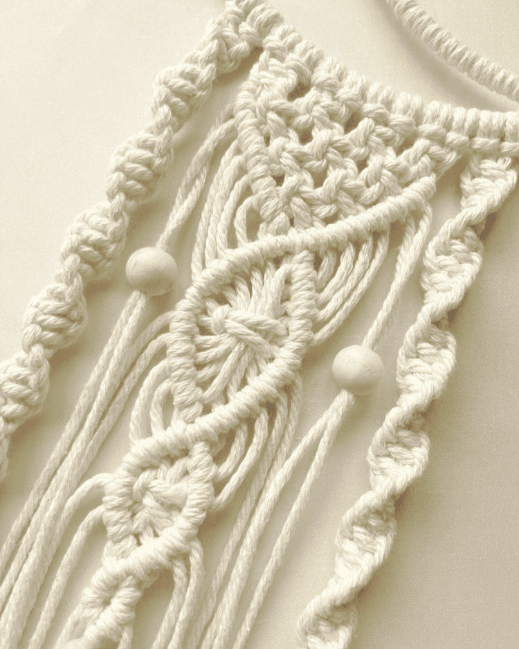 Close-up of handmade macramé crescent moon wall hanging with intricate cotton knots and wooden beads – Islamic boho decor by Samra Knots