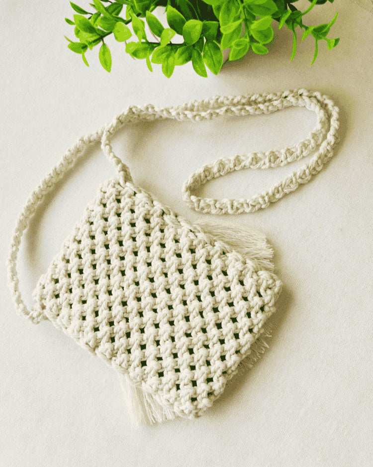 Back view of woven macramé phone bag in off-white cotton – boho textured pattern