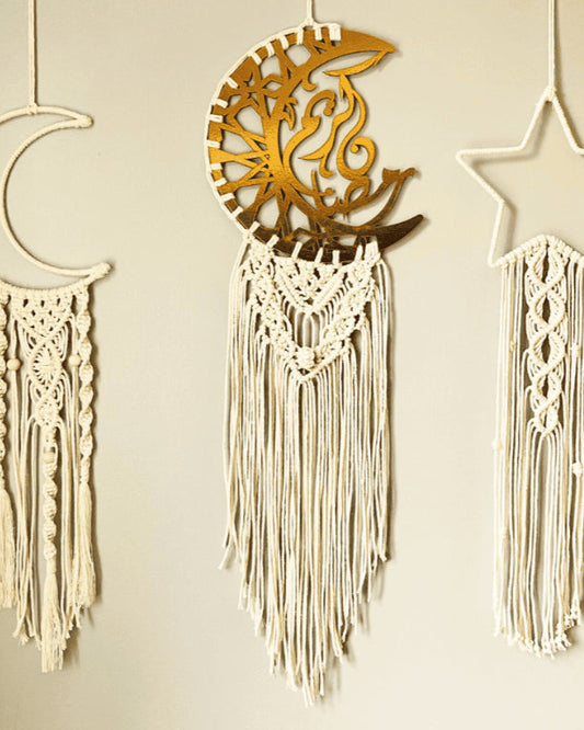 Handmade Islamic macramé wall hanging set featuring moon, Arabic calligraphy crescent, and star designs in off-white cotton cord with gold accents.