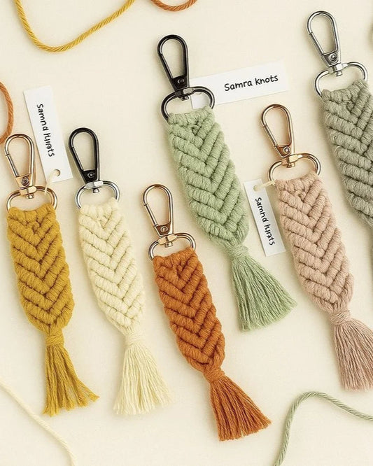 Handmade macramé mermaid tail keychains in boho colors with metal clasps, displayed on a neutral background – Samra Knots.