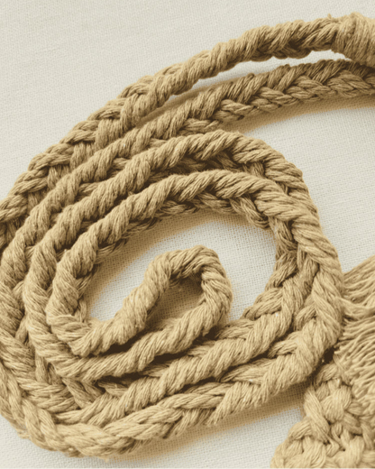 Close-up of the light brown cotton macramé strap showing intricate braided design and soft fibre texture.